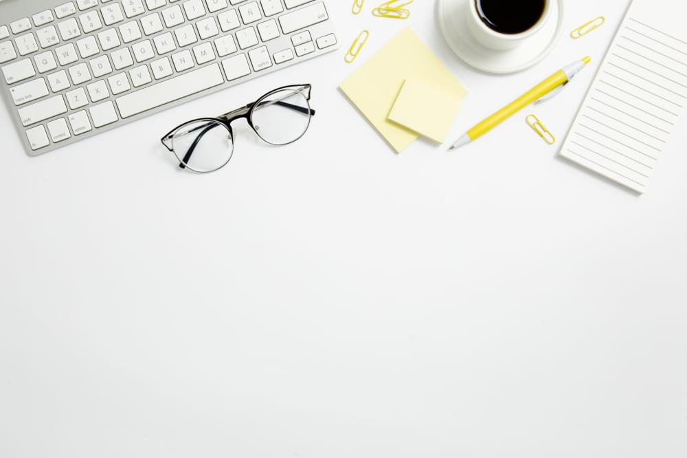 Flat-lay-stationary-composition-on-desk-with-copy-space.jpg